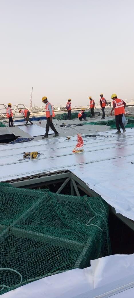 Commercial architectural roofing at Oberoi Mall, Mumbai: Specialized Kliplok roof-on-roof installation by Rishonn & Reyansh for leak-proof retail infrastructure.